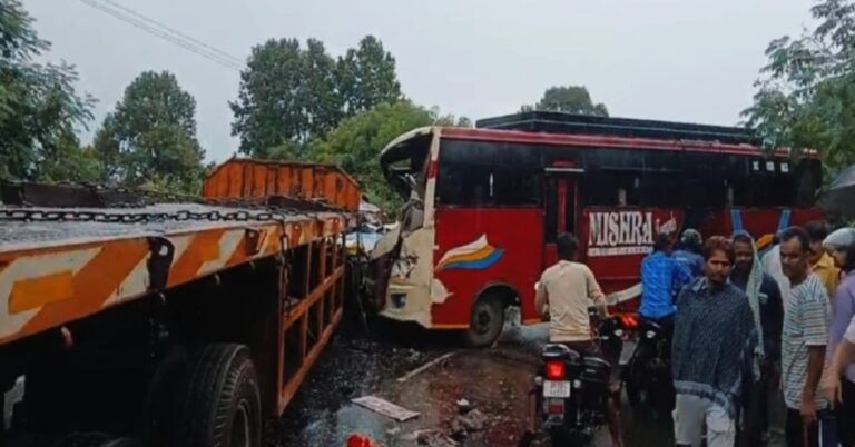 Severely damaged bus and trailer after Dhanbad road accident near Kamalpur